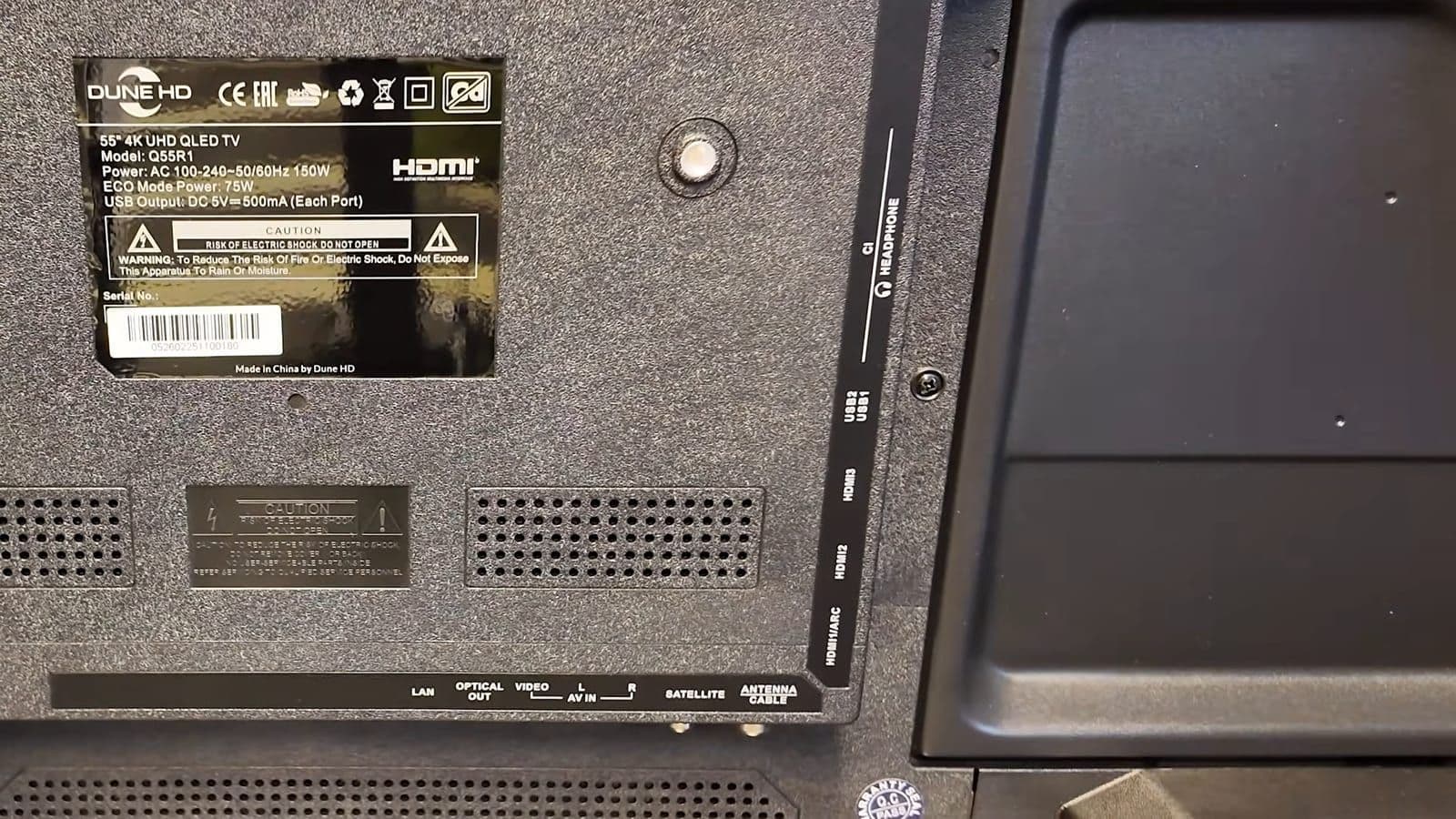 Rear panel of the Dune HD Q55R1 with labels for LAN, optical out, AV in, satellite and antenna ports