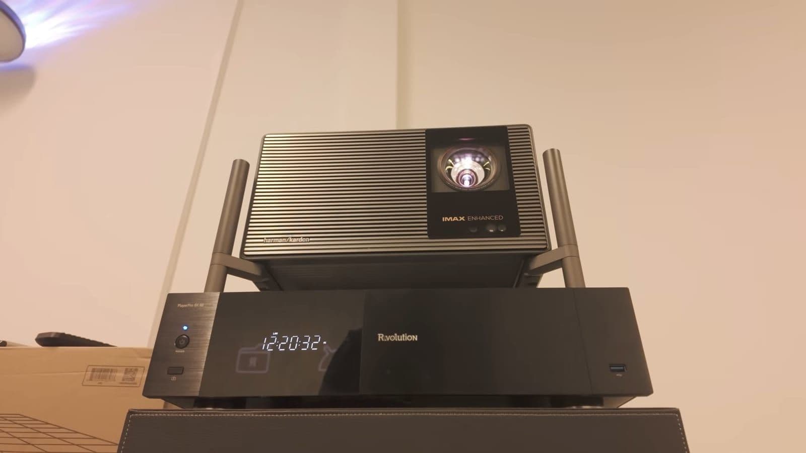 R_volution PlayerPro 8K TV media player placed underneath an XGIMI projector on a flight case