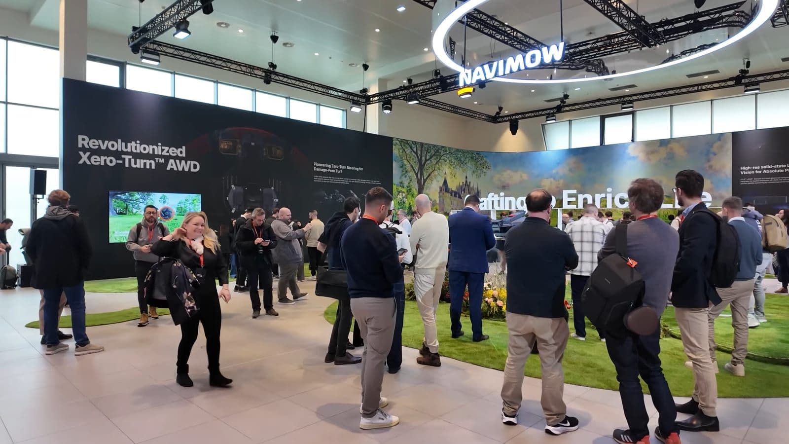 Tech journalists and attendees gathered at the Paris launch event for the Segway Navimow 2026 lineup