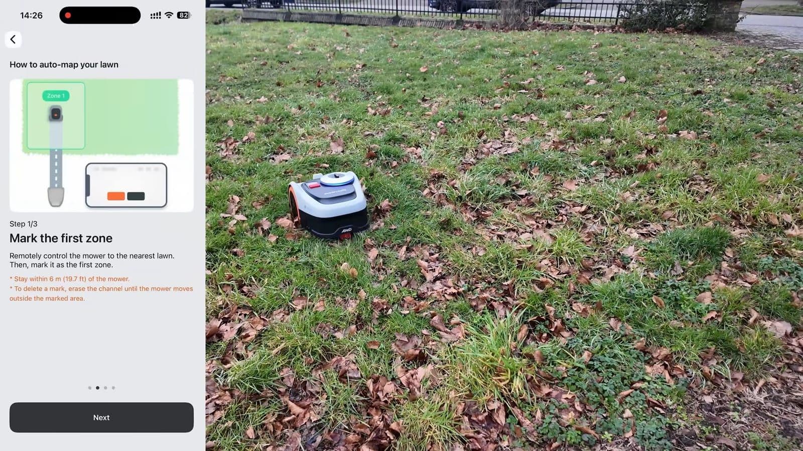 The Segway Navimow phone app displaying auto-mapping instructions next to the i2 mower on a leaf-strewn lawn
