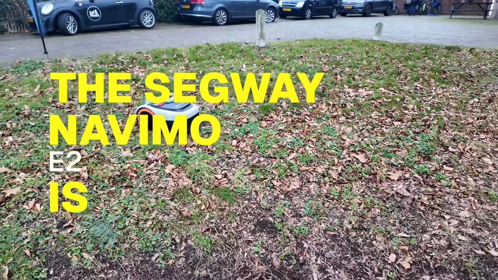 Segway Navimow i2 AWD cutting grass quietly across an open backyard lawn